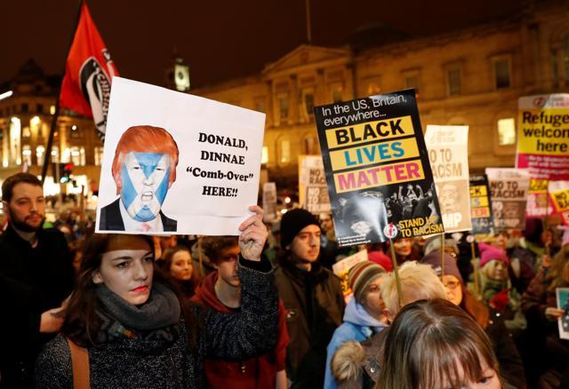 Demonstrators hold up banners during a protest against the inauguration of Donald Trump as US President in Edinburgh, Scotland, Britain. (REUTERS)