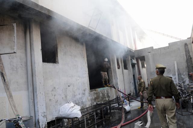According to the workers, the cause of the fire was supposedly the wood kept in the basement of the building. (Burhaan Kinu/HT Photo) According to the workers, the cause of the fire was supposedly the wood kept in the basement of the building. (Burhaan Kinu/HT Photo)