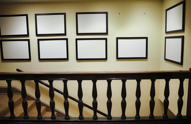 Photos of President Barack Obama and his family, that for years have lined the walls of corridors in the West Wing of the White House in Washington, are now blank and empty, Thursday, Jan. 19, 2017. Only a skeleton staff remained at the White House on Thursday, creating an eerily quiet feeling in the normally bustling West Wing. (AP) Photos of President Barack Obama and his family, that for years have lined the walls of corridors in the West Wing of the White House in Washington, are now blank and empty, Thursday, Jan. 19, 2017. Only a skeleton staff remained at the White House on Thursday, creating an eerily quiet feeling in the normally bustling West Wing. (AP)