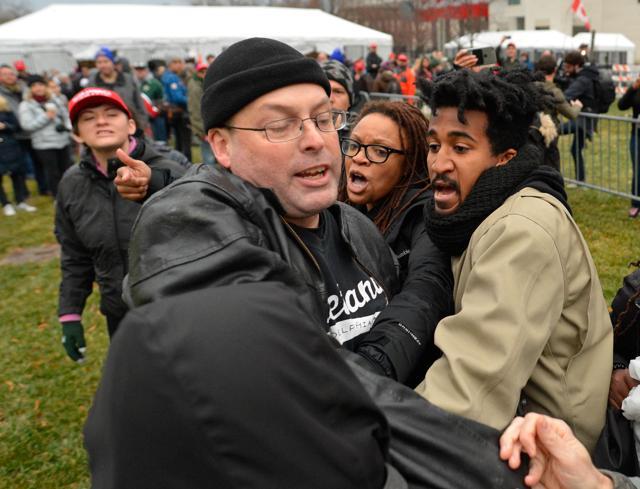 Protesters attack a man trying to pass at an entry point prior at the inauguration of US president-elect Donald Trump in Washington on January 20, 2017. (Reuters) Protesters attack a man trying to pass at an entry point prior at the inauguration of US president-elect Donald Trump in Washington on January 20, 2017. (Reuters)