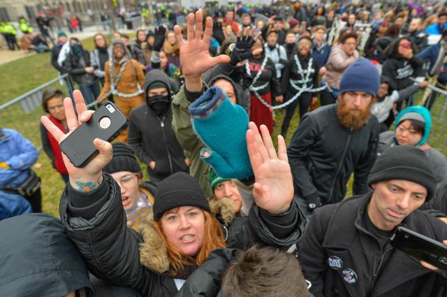 Protesters block members of the press as they chain themselves to an entry point prior at the inauguration of US President-elect Donald Trump in Washington, DC. (REUTERS) Protesters block members of the press as they chain themselves to an entry point prior at the inauguration of US President-elect Donald Trump in Washington, DC. (REUTERS)
