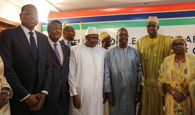 A handout photo released by the Senegalese Presidency shows Adama Barrow (C) posing with (from L) Senegalese Foreign Minister Mankeur Ndiaye, President of the Commission of ECOWAS Marcel Alain de Souza, Senegalese Prime Minister Mohammed Dionne and Senegalese deputy and ECOWAS speaker Moustapha Cisse Lo during his swearing in as president of Gambia at the Gambian embassy in Dakar on January 19, 2017. (AFP) A handout photo released by the Senegalese Presidency shows Adama Barrow (C) posing with (from L) Senegalese Foreign Minister Mankeur Ndiaye, President of the Commission of ECOWAS Marcel Alain de Souza, Senegalese Prime Minister Mohammed Dionne and Senegalese deputy and ECOWAS speaker Moustapha Cisse Lo during his swearing in as president of Gambia at the Gambian embassy in Dakar on January 19, 2017. (AFP)