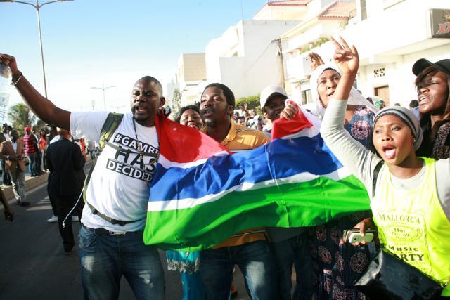 Supporters of Gambia's President-elect Adama Barrow celebrate outside of the Gambian Embassy in Dakar on January 19, 2017. (AFP) Supporters of Gambia's President-elect Adama Barrow celebrate outside of the Gambian Embassy in Dakar on January 19, 2017. (AFP)