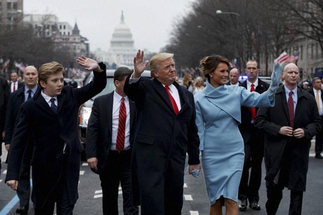 American President Donald Trump and First Lady Melania Trump walk along the Inauguration Day parade route in Washington on Friday. (AP) American President Donald Trump and First Lady Melania Trump walk along the Inauguration Day parade route in Washington on Friday. (AP)
