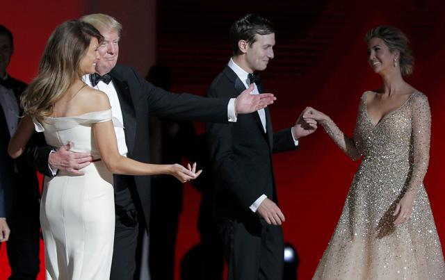 US President Donald Trump and his wife first lady Melania Trump (left) gesture towards his daughter Ivanka and her husband Jared Kushner as they dance their first dance as first couple to Frank Sinatra's song "My Way" at his "Liberty" Inaugural Ball in Washington. (Reuters)