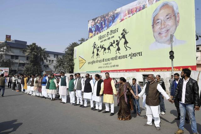 Citizens make a human chain to support liquor prohibition. (PTI Photo) Citizens make a human chain to support liquor prohibition. (PTI Photo)