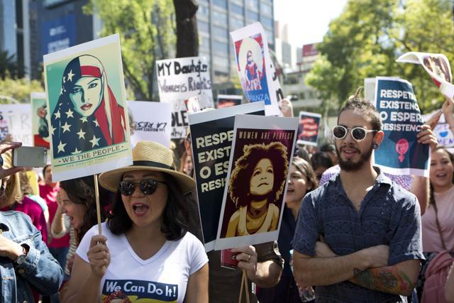People hold signs during a Women's March protest in front of the US embassy in Mexico City, Saturday, Jan 21. (AP Photo) People hold signs during a Women's March protest in front of the US embassy in Mexico City, Saturday, Jan 21. (AP Photo)