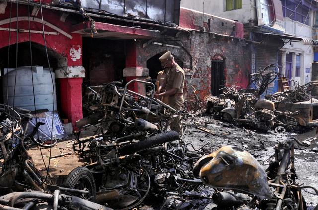 Policemen inspect charred remains of the Ice House police station which was set on fire by the demonstrators during a protest demanding a permanent solution to ensure the unhindered conduct of Jallikattu, a traditional bull-taming contest, in Chennai. (REUTERS) Policemen inspect charred remains of the Ice House police station which was set on fire by the demonstrators during a protest demanding a permanent solution to ensure the unhindered conduct of Jallikattu, a traditional bull-taming contest, in Chennai. (REUTERS)
