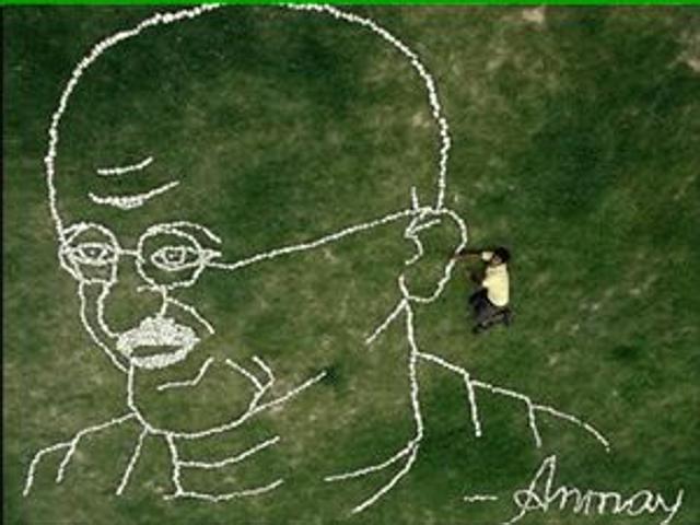 Saha with an art work on ground featuring Mahatma Gandhi, clicked from a bird’s view. (HT Photo)
