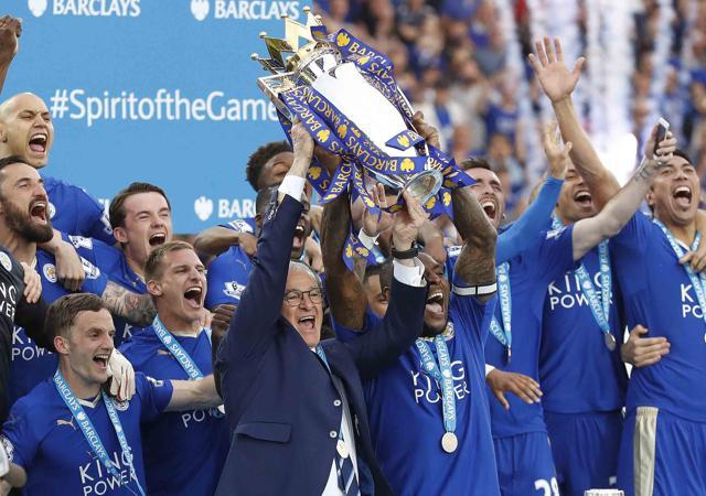 Leicester City manager Claudio Ranieri and skipper Wes Morgan lift the Premier League trophy. (AP) Leicester City manager Claudio Ranieri and skipper Wes Morgan lift the Premier League trophy. (AP)