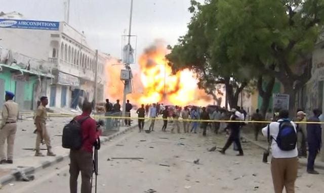 A still from a Reuters TV video shows a secondary explosion after a suspected suicide car bomb rammed into the gates of a hotel in Mogadishu. (REUTERS) A still from a Reuters TV video shows a secondary explosion after a suspected suicide car bomb rammed into the gates of a hotel in Mogadishu. (REUTERS)