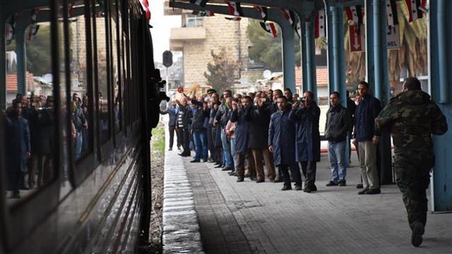 Syrians take pictures of a train pulling in Aleppo’s main Baghdad railway station on January 25, 2017, as passengers rode across the city for the first time in more than four years. (AFP Photo) Syrians take pictures of a train pulling in Aleppo’s main Baghdad railway station on January 25, 2017, as passengers rode across the city for the first time in more than four years. (AFP Photo)