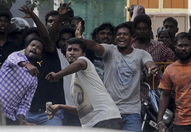 Protestors supporting Jallikattu throw stones as they clash with police in Chennai. (AP Photo) Protestors supporting Jallikattu throw stones as they clash with police in Chennai. (AP Photo)