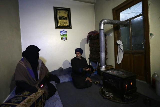 Um Imad and her husband Ahmed Jassem sit in a friend's borrowed apartment, facing their old home that collapsed into the street, in Aleppo's formerly rebel-held al-Shaar neighbourhood. (AFP Photo) Um Imad and her husband Ahmed Jassem sit in a friend's borrowed apartment, facing their old home that collapsed into the street, in Aleppo's formerly rebel-held al-Shaar neighbourhood. (AFP Photo)