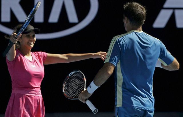Sania Mirza (left) celebrates with Croatia’s Ivan Dodig after winning their mixed doubles' semi-final against Australia's Samantha Stosur and Sam Groth at the Australian Open in Melbourne on Friday. (AP) Sania Mirza (left) celebrates with Croatia’s Ivan Dodig after winning their mixed doubles' semi-final against Australia's Samantha Stosur and Sam Groth at the Australian Open in Melbourne on Friday. (AP)