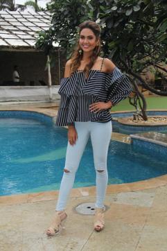 Esha Gupta at a movie promotion in a cold shoulder top teamed with fitted denims. (Hindustan Times)