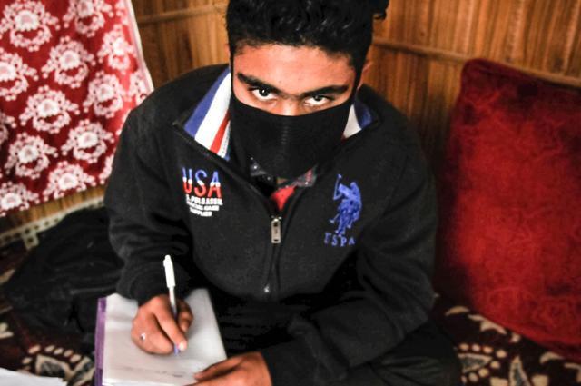 Tabish Rafiq Bhat studies for his board exams at his home, in Pampore. (Waseem Andrabi/HT File Photo) Tabish Rafiq Bhat studies for his board exams at his home, in Pampore. (Waseem Andrabi/HT File Photo)