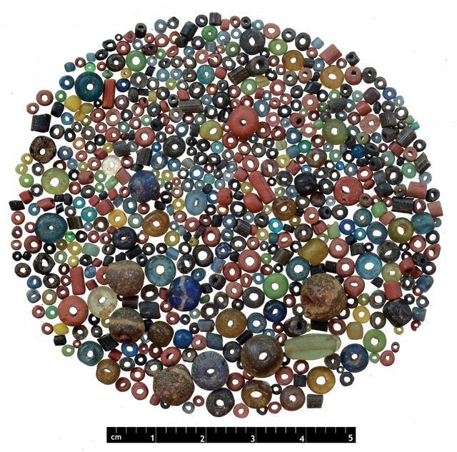Glass beads and decorative stones found at the site (GRTSI Media) Glass beads and decorative stones found at the site (GRTSI Media)