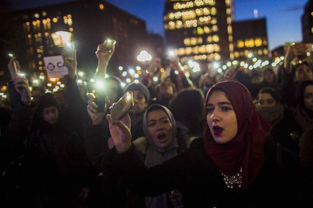 Muslim women shout slogans during a rally against President Donald Trump's order cracking down on immigrants living in the US, at Washington Square Park in New York. (AP Photo) Muslim women shout slogans during a rally against President Donald Trump's order cracking down on immigrants living in the US, at Washington Square Park in New York. (AP Photo)