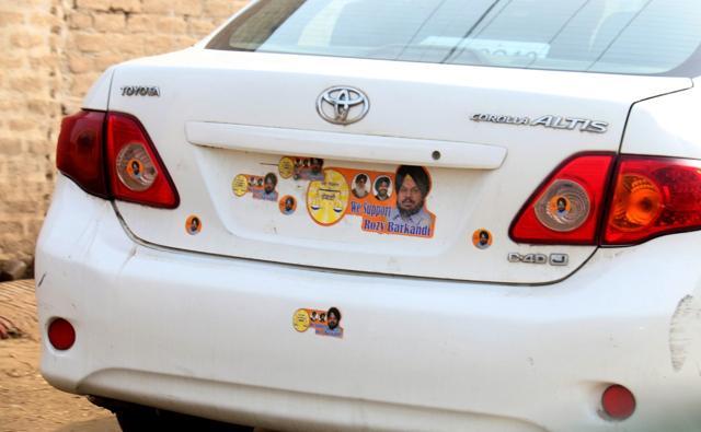 Spotted in Bathinda: An Akali Dal supporter’s car with stickers of the party’s Muktsar candidate Kanwarjit Singh Rozy Barkandi in place of the registration plate. (Sanjeev Kumar/HT Photo) Spotted in Bathinda: An Akali Dal supporter’s car with stickers of the party’s Muktsar candidate Kanwarjit Singh Rozy Barkandi in place of the registration plate. (Sanjeev Kumar/HT Photo)