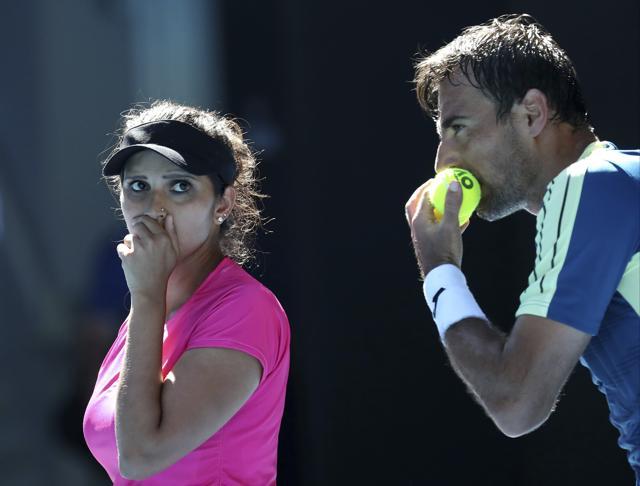 India's Sania Mirza and Ivan Dodig of Croatia talk tactics during their mixed doubles' final against Abigail Speers of the US and Juan Sebastian Cabal of Colombia. (AP) India's Sania Mirza and Ivan Dodig of Croatia talk tactics during their mixed doubles' final against Abigail Speers of the US and Juan Sebastian Cabal of Colombia. (AP)