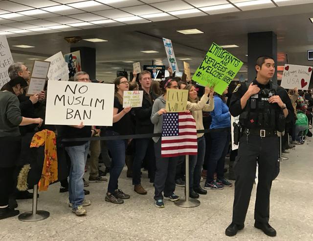 People protest against the travel ban imposed by U.S. President Donald Trump's executive order, at Washington Dulles International Airport in Dulles, Virginia, U.S. January 28, 2017. (REUTERS Photo) People protest against the travel ban imposed by U.S. President Donald Trump's executive order, at Washington Dulles International Airport in Dulles, Virginia, U.S. January 28, 2017. (REUTERS Photo)