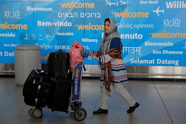 A woman exits immigration after arriving from Dubai on Emirates Flight 203 at John F Kennedy International Airport in Queens, New York. (REUTERS) A woman exits immigration after arriving from Dubai on Emirates Flight 203 at John F Kennedy International Airport in Queens, New York. (REUTERS)