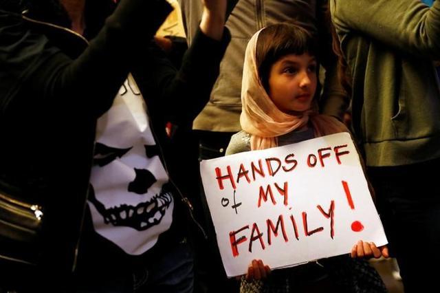 Rosalie Gurna, 9, holds a sign in support of Muslim family members as people protest against U.S. President Donald Trump's travel ban on Muslim majority countries at the International terminal at Los Angeles International Airport. (Reuters) Rosalie Gurna, 9, holds a sign in support of Muslim family members as people protest against U.S. President Donald Trump's travel ban on Muslim majority countries at the International terminal at Los Angeles International Airport. (Reuters)