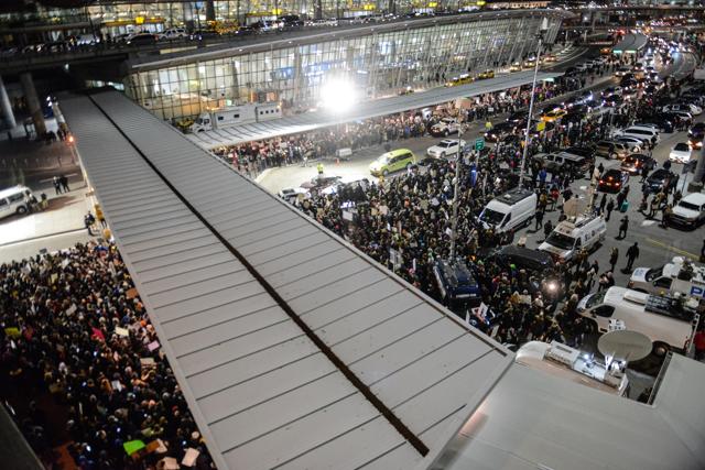 Protestors rally during a demonstration against the new immigration ban issued by President Donald Trump at John F Kennedy International Airport. (AFP Photo) Protestors rally during a demonstration against the new immigration ban issued by President Donald Trump at John F Kennedy International Airport. (AFP Photo)