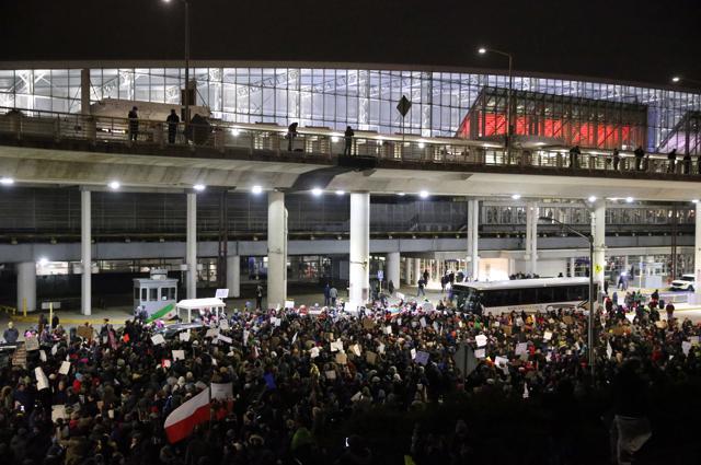 Protesters gather at O'Hare International Airport after more than a dozen were detained, including green card holders, Saturday, Jan. 28, 2017, in Chicago. (AP Photo) Protesters gather at O'Hare International Airport after more than a dozen were detained, including green card holders, Saturday, Jan. 28, 2017, in Chicago. (AP Photo)