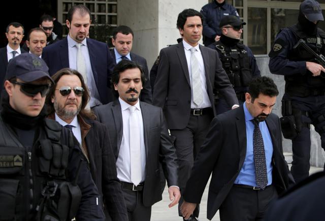 Turkish officers are escorted by Greek special police forces as they leave the Greek Supreme Court in Athens on January 23 after a hearing concerning a possible extradition of the officers over July's failed coup in Turkey. (AFP File) Turkish officers are escorted by Greek special police forces as they leave the Greek Supreme Court in Athens on January 23 after a hearing concerning a possible extradition of the officers over July's failed coup in Turkey. (AFP File)