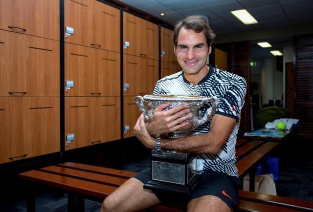 Roger Federer hugs the trophy after winning the Men's singles final at the Australian Open tennis tournament in Melbourne. (REUTERS) Roger Federer hugs the trophy after winning the Men's singles final at the Australian Open tennis tournament in Melbourne. (REUTERS)