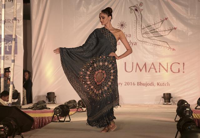 A model showcases a sari created by artisan Monghi Rabari . A model showcases a sari created by artisan Monghi Rabari .