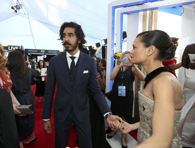 Actor Dev Patel greets actress Thandie Newton as they arrive at the 23rd Screen Actors Guild Awards in Los Angeles. (REUTERS) Actor Dev Patel greets actress Thandie Newton as they arrive at the 23rd Screen Actors Guild Awards in Los Angeles. (REUTERS)