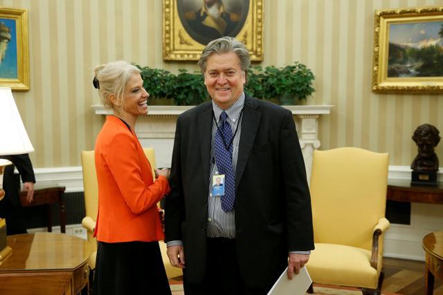 White House Senior Advisor Kellyanne Conway smiles with chief strategist Steve Bannon on the sidelines as US President Donald Trump meets with labour leaders in the Oval Office at the White House in Washington. (Reuters ) White House Senior Advisor Kellyanne Conway smiles with chief strategist Steve Bannon on the sidelines as US President Donald Trump meets with labour leaders in the Oval Office at the White House in Washington. (Reuters )