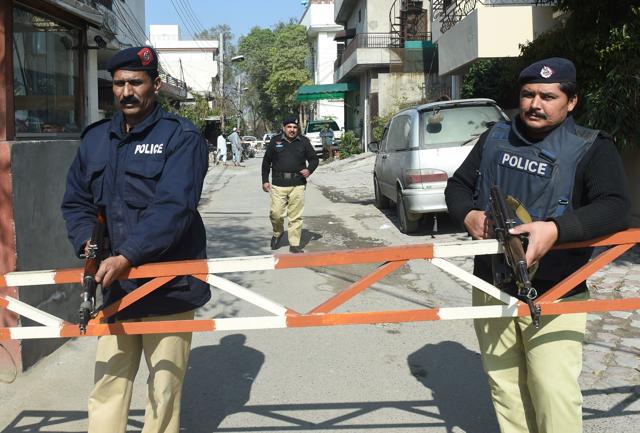 Pakistani policemen stand guard outside Hafiz Saeed’s home in Lahore on Tuesday. (AFP) Pakistani policemen stand guard outside Hafiz Saeed’s home in Lahore on Tuesday. (AFP)