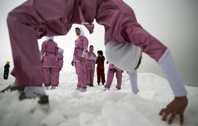 Shaolin martial arts students practise on a hilltop in the snow, in Kabul. (AP) Shaolin martial arts students practise on a hilltop in the snow, in Kabul. (AP)