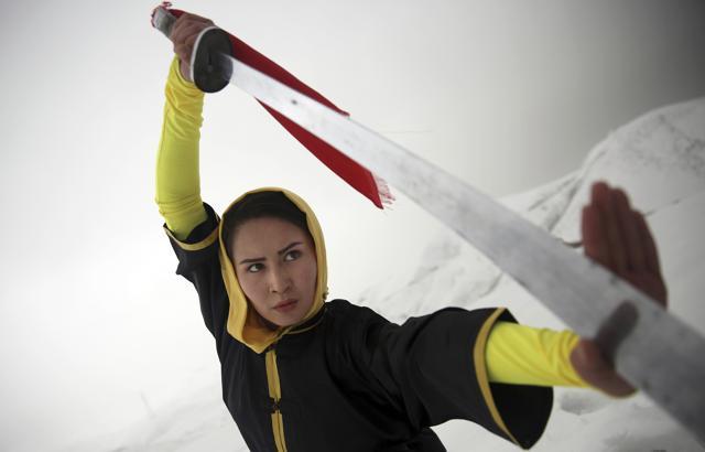 Shaolin martial arts trainer, Sima Azimi, 20, performs on a hilltop in Kabul, Afghanistan. (AP Photo) Shaolin martial arts trainer, Sima Azimi, 20, performs on a hilltop in Kabul, Afghanistan. (AP Photo)
