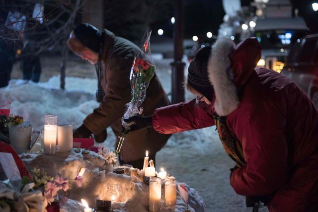 People place candles near a mosque that was the location of a shooting spree in Quebec City, Quebec on January 31, 2017. (AFP Photo) People place candles near a mosque that was the location of a shooting spree in Quebec City, Quebec on January 31, 2017. (AFP Photo)