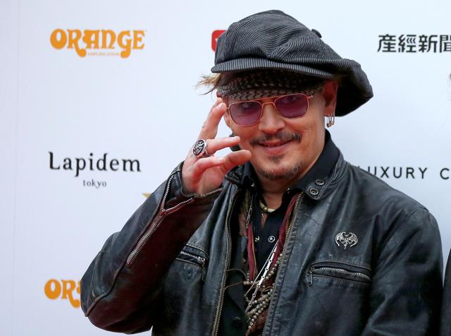 Johnny Depp poses on the red carpet at the 2016 Classic Rock Roll of Honour awards in Tokyo, Japan. (REUTERS) Johnny Depp poses on the red carpet at the 2016 Classic Rock Roll of Honour awards in Tokyo, Japan. (REUTERS)