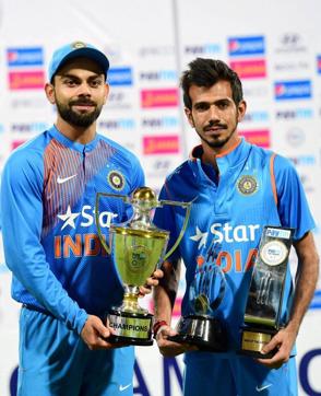 Virat Kohli with Yuzuvendra Chahal after India winning the T20 series against England at Chinnaswamy Stadium in Bengaluru on Wednesday. (PTI) Virat Kohli with Yuzuvendra Chahal after India winning the T20 series against England at Chinnaswamy Stadium in Bengaluru on Wednesday. (PTI)