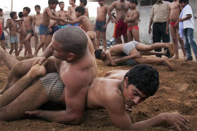 An akhara photograph in Tigri by Namrata Alex and Soaib at Evidence Room: A Retrospective of Negotiating Routes.