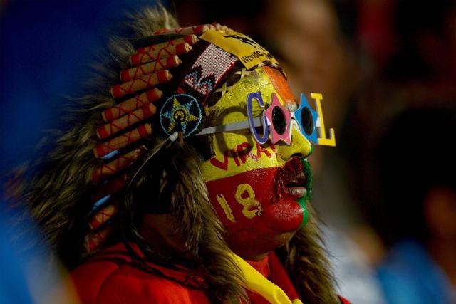 An Indian fan dressed as an Apache watches the third T20 cricket match between India and England at the Chinnaswamy Stadium in Bangalore on Wednesday. (AFP)