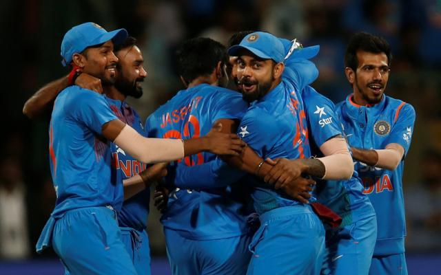 India's captain Virat Kohli celebrates with teammates after winning the third T20 against England in Bangalore on Wednesday. (REUTERS)