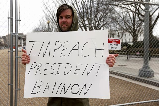 A protester holds a sign calling for the removal of Chief White House strategist Steve Bannon outside the White House in Washington, U.S., January 30, 2017. (REUTERS) A protester holds a sign calling for the removal of Chief White House strategist Steve Bannon outside the White House in Washington, U.S., January 30, 2017. (REUTERS)