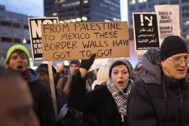 Demonstrators protest in in Chicago on February 1 against President Donald Trump's executive order which imposes a freeze on admitting refugees into the USt and a ban on travel from seven Muslim-majority countries. (AFP) Demonstrators protest in in Chicago on February 1 against President Donald Trump's executive order which imposes a freeze on admitting refugees into the USt and a ban on travel from seven Muslim-majority countries. (AFP)