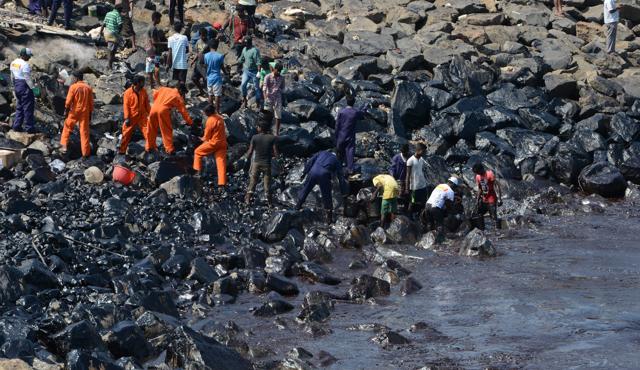 Locals have been assisting the Coast Guard Pollution Response Teams in the clean-up operation. (V. Srinivasulu/Hindustan Times) Locals have been assisting the Coast Guard Pollution Response Teams in the clean-up operation. (V. Srinivasulu/Hindustan Times)