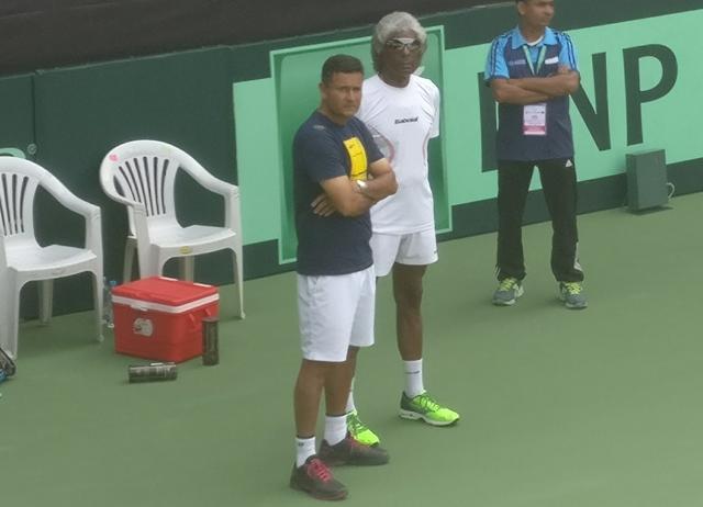 India captain Anand Amritraj and Zeeshan Ali have a quick chat as players warm up before the first singles. Catch India vs New Zealand Davis Cup live score and updates here. (HT Photo) India captain Anand Amritraj and Zeeshan Ali have a quick chat as players warm up before the first singles. Catch India vs New Zealand Davis Cup live score and updates here. (HT Photo)