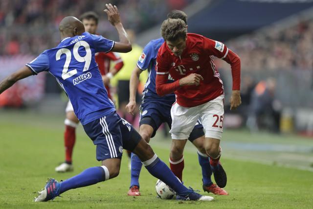 Schalke's Naldo, left, and Bayern's Thomas Mueller challenge for the ball. (AP) Schalke's Naldo, left, and Bayern's Thomas Mueller challenge for the ball. (AP)