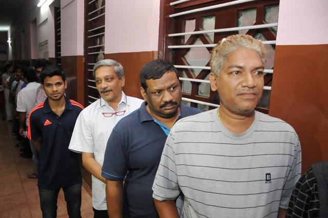 Defence minister Manohar Parrikar in a queue outside a polling booth to cast his vote in Goa on Saturday. (PTI) Defence minister Manohar Parrikar in a queue outside a polling booth to cast his vote in Goa on Saturday. (PTI)